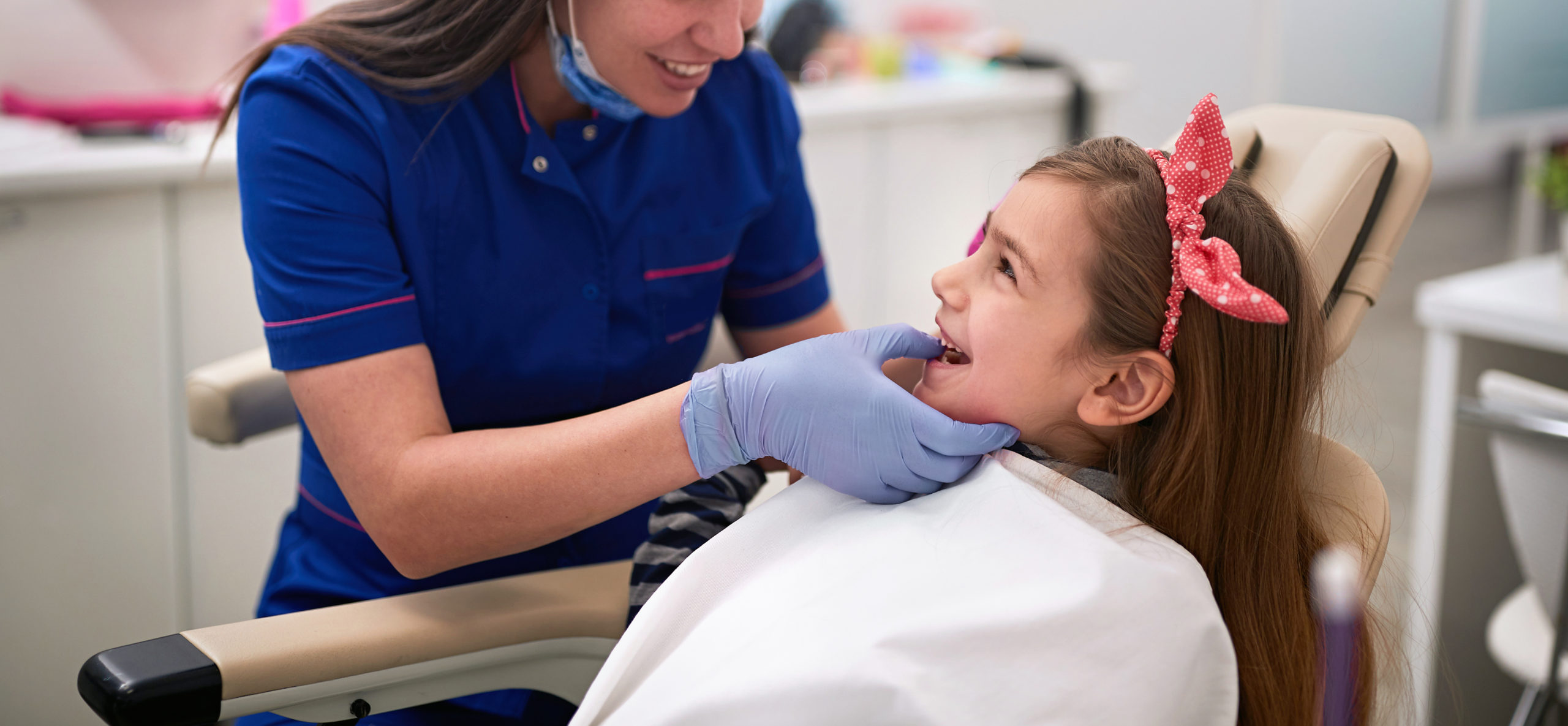 Dentist,Examining,His,Girl,Patient,In,Dentist’s,Office