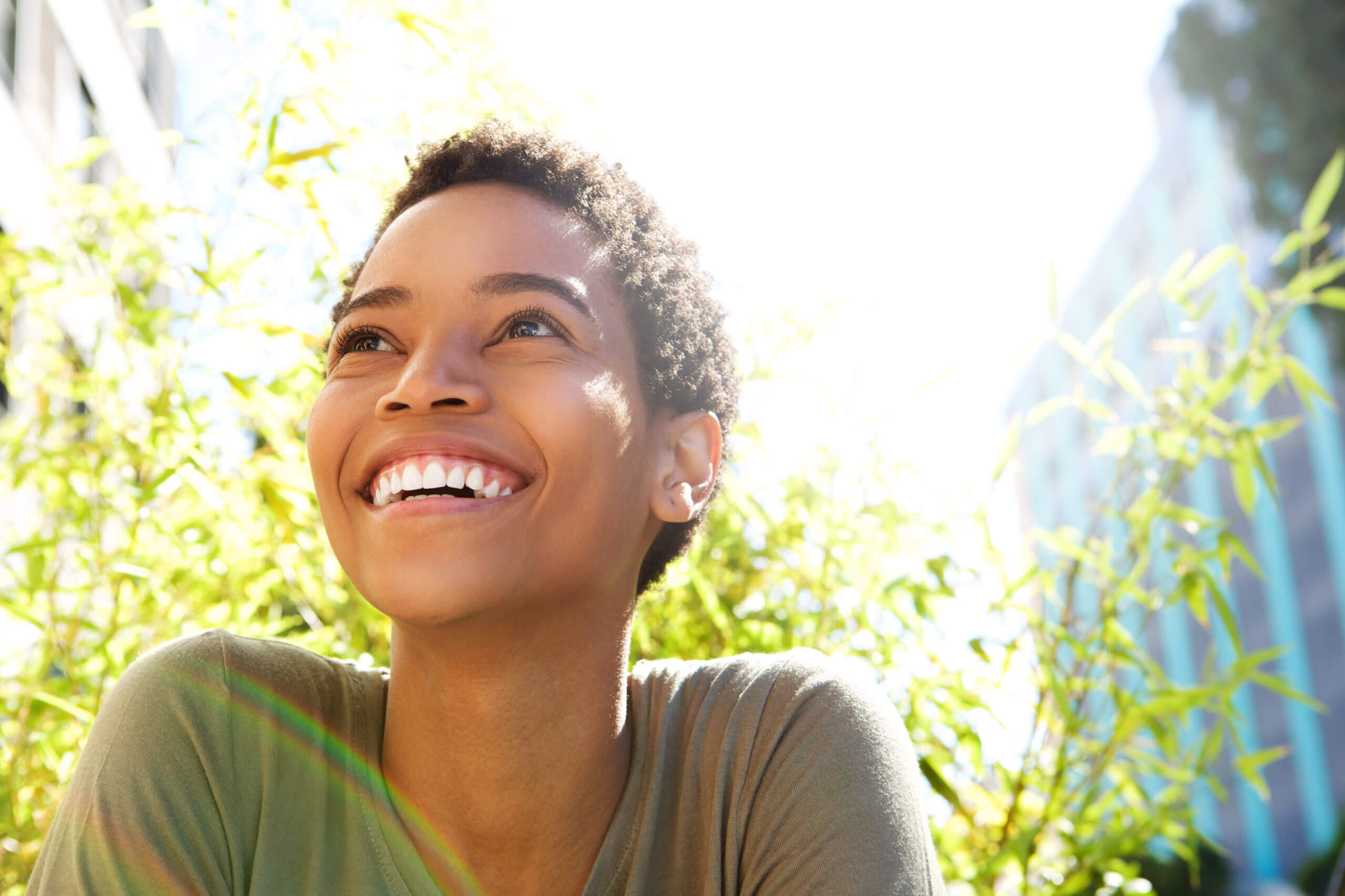 Close,Up,Portrait,Of,Beautiful,Young,Black,Woman,Smiling,Outdoors
