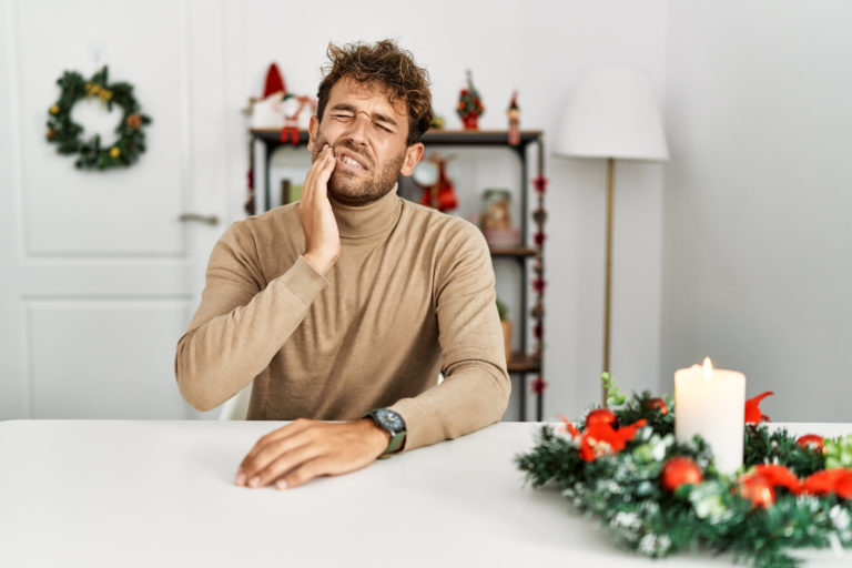 A man with tooth pain on the holidays