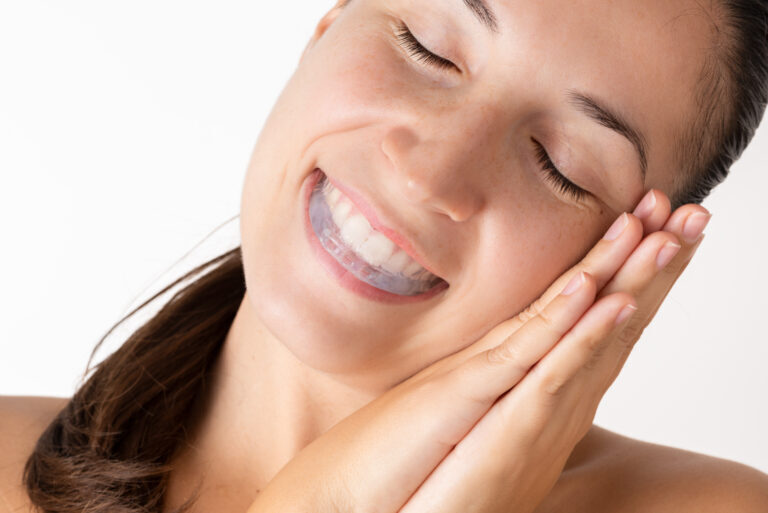 woman wearing night mouth guard for teeth grinding