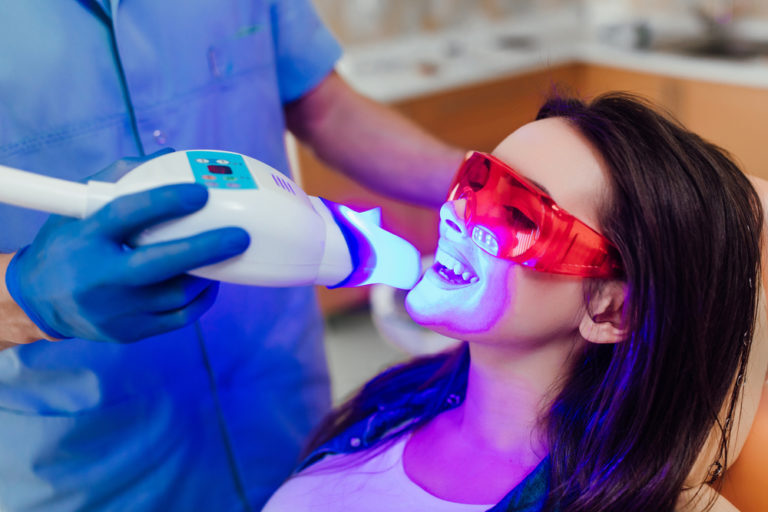 Woman getting her teeth whitened
