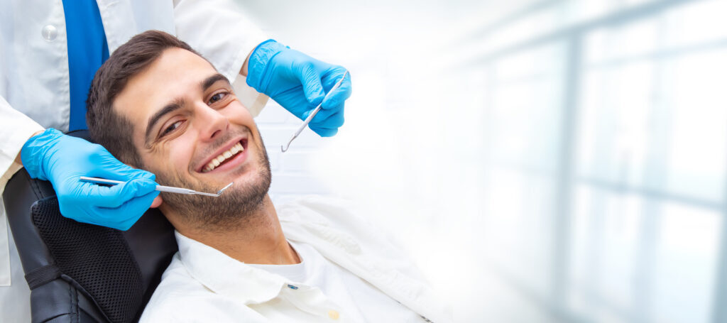 young man in the dentist